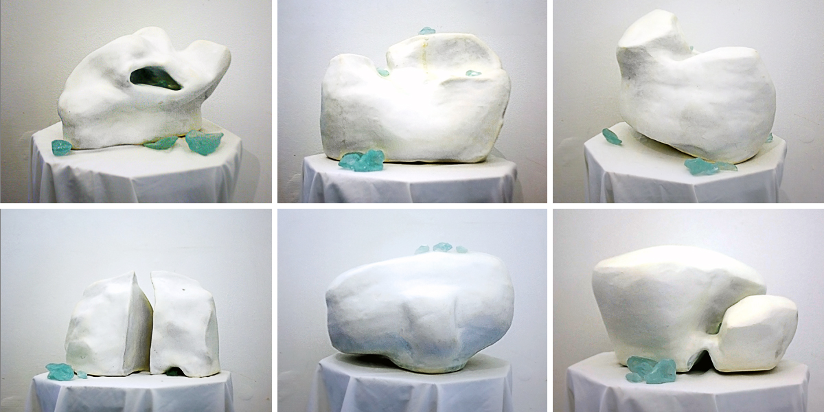 Collection of ceramic artworks on plinths and on the wall.