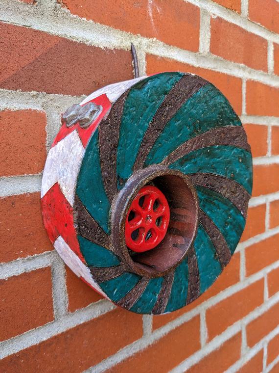 Twirl (2024) Red stoneware, glass, underglaze, oxide washes. Electric fired. Cold worked. Wall piece. Rondeau.